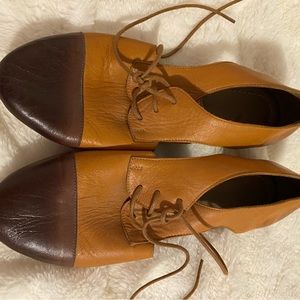 Laced Bueno Shoes with side cut out. Brand new.